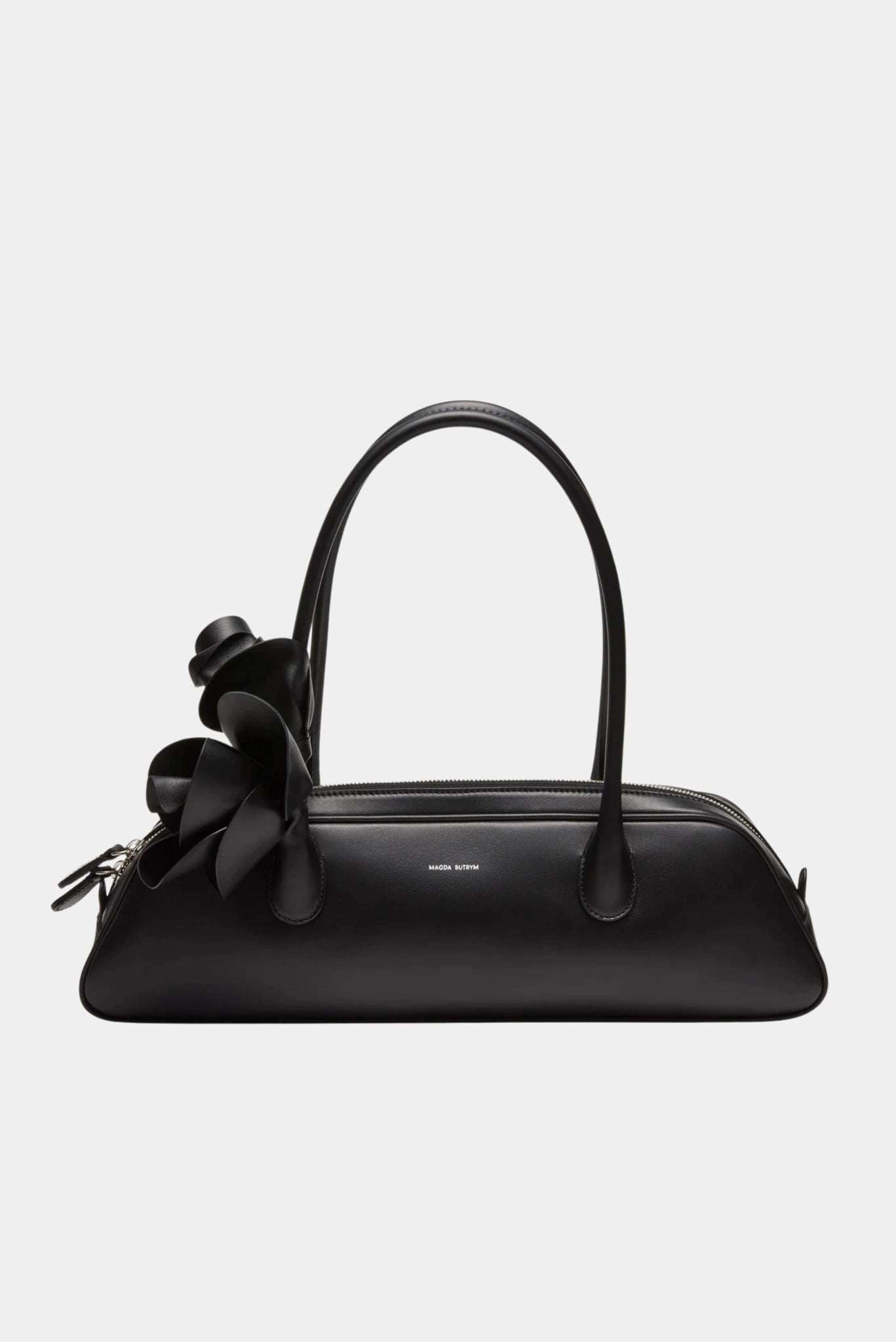 Bolsa Brigitte Magda Butrym em couro preto com silhueta alongada e aplicação floral característica