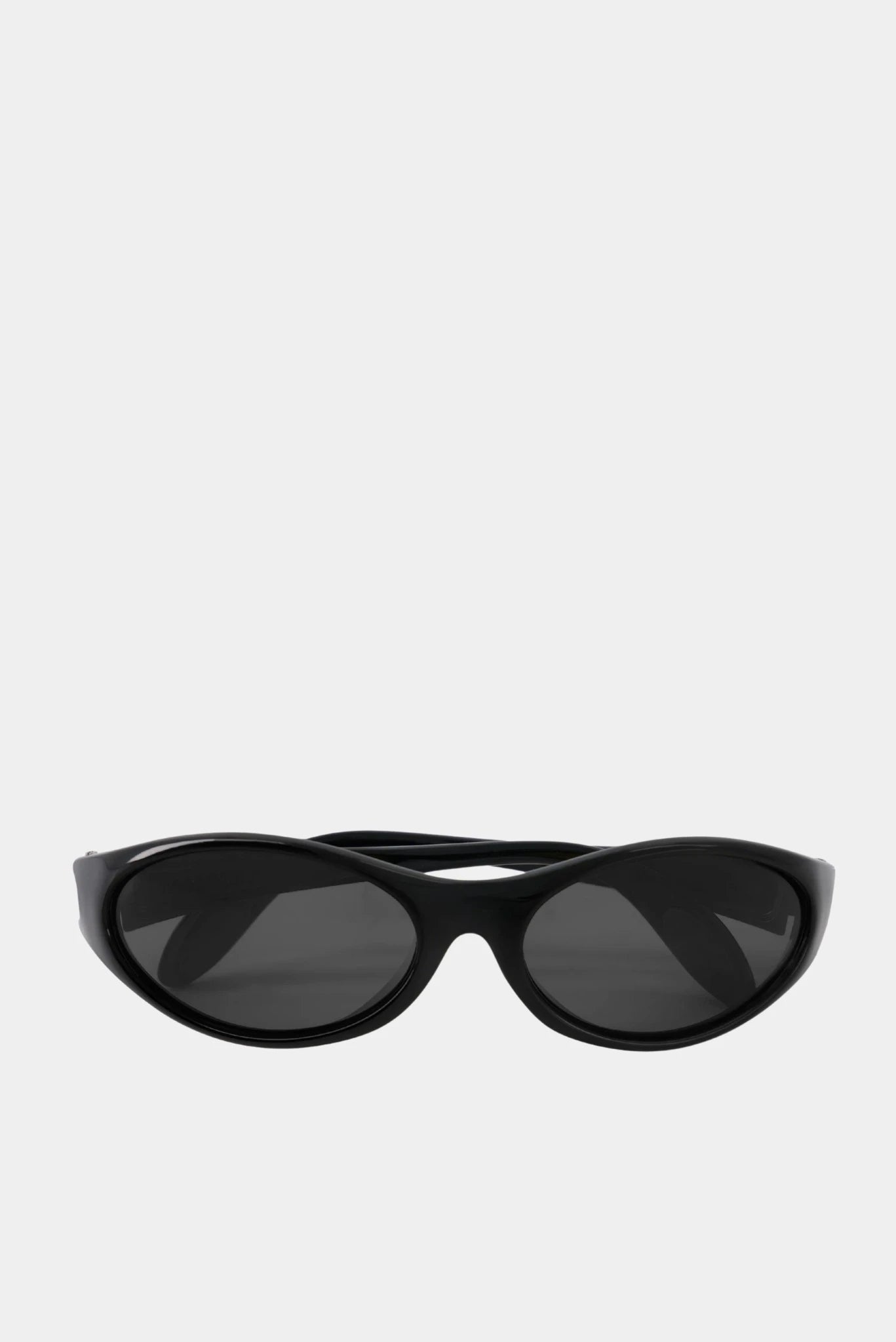 Óculos de sol femininos pretos com design oval minimalista e lentes fumê Coperni