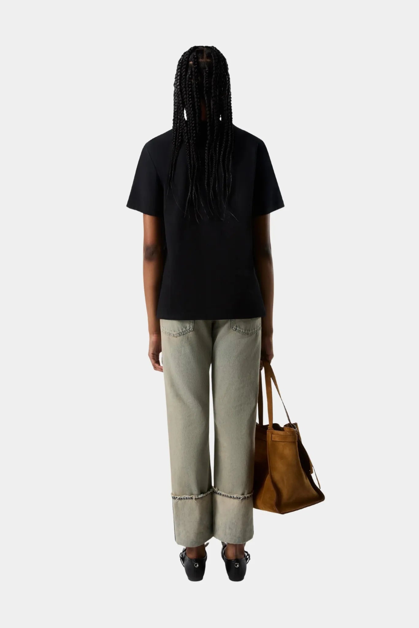 Costas de camiseta preta Coperni com modelagem reta minimalista